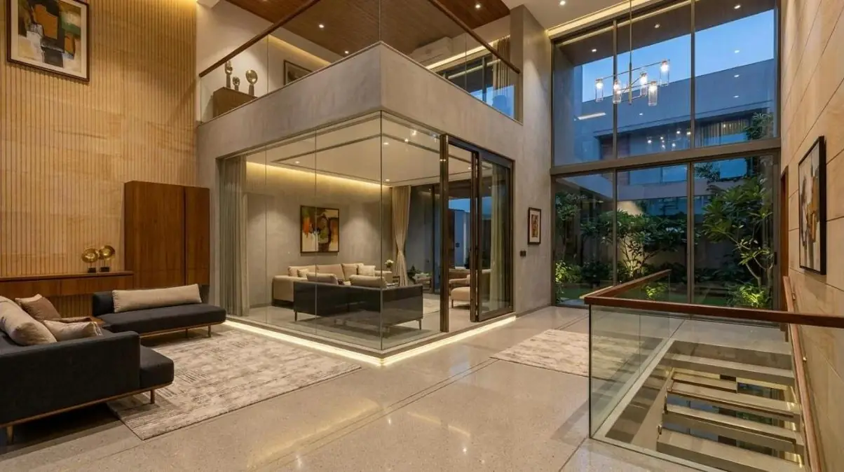 Glass room and railing in a double-height home